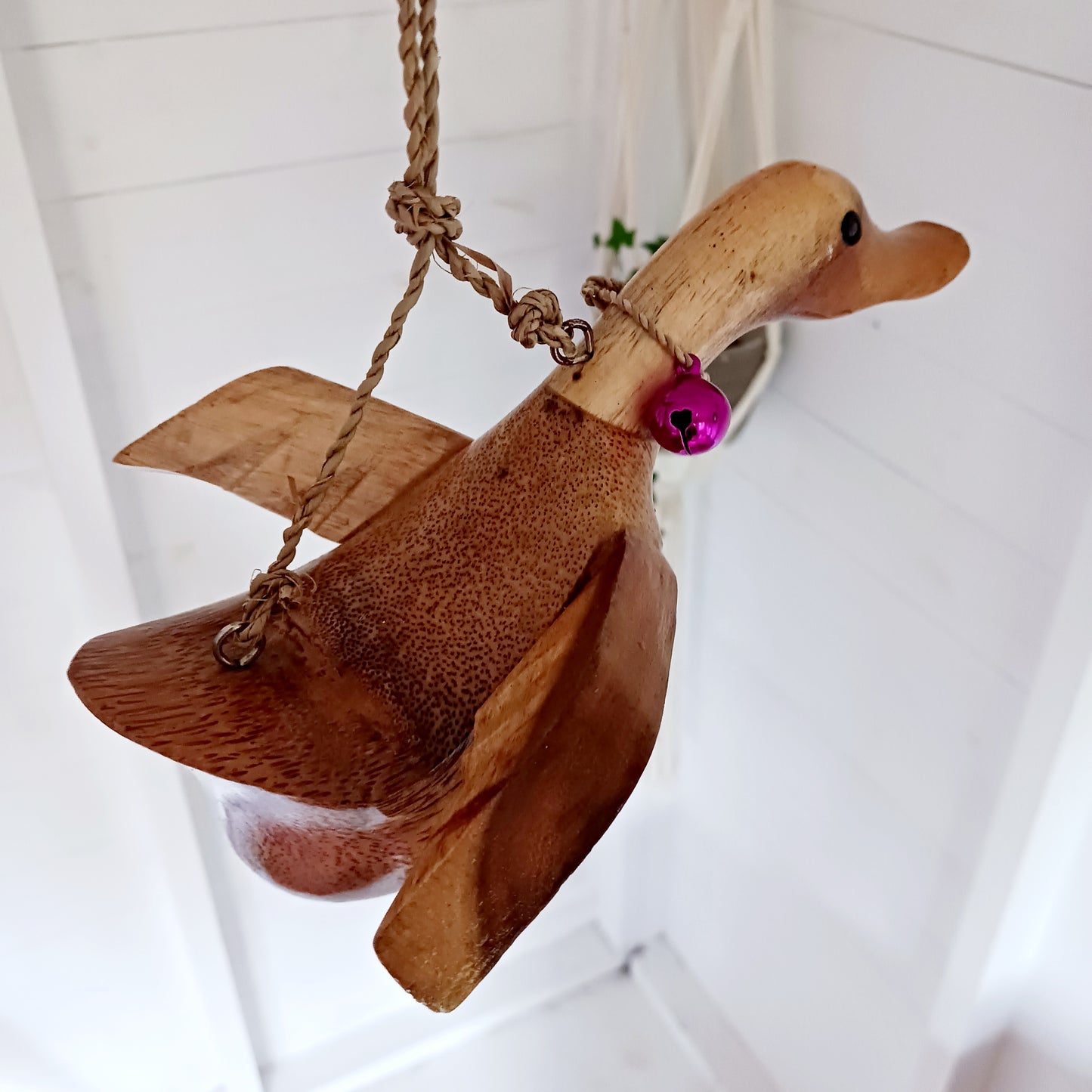 Bring a touch of whimsy and natural beauty to your home with this Handcarved Wooden Flying Duck. Each piece is meticulously crafted from solid wood, showcasing the artisan’s skill and attention to detail. The duck’s natural finish highlights the unique wood grain, adding a rustic charm that complements any interior style.