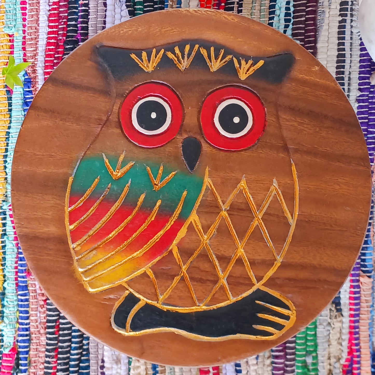 This lovely handmade, carved and painted stool is Fairtrade from Thailand. The top of this stool has been carefully hand carved and then painted to show a beautiful rustic owl. These cheeky little items are very versatile making great stools for little bums or as tiny tables to add accent to your home.