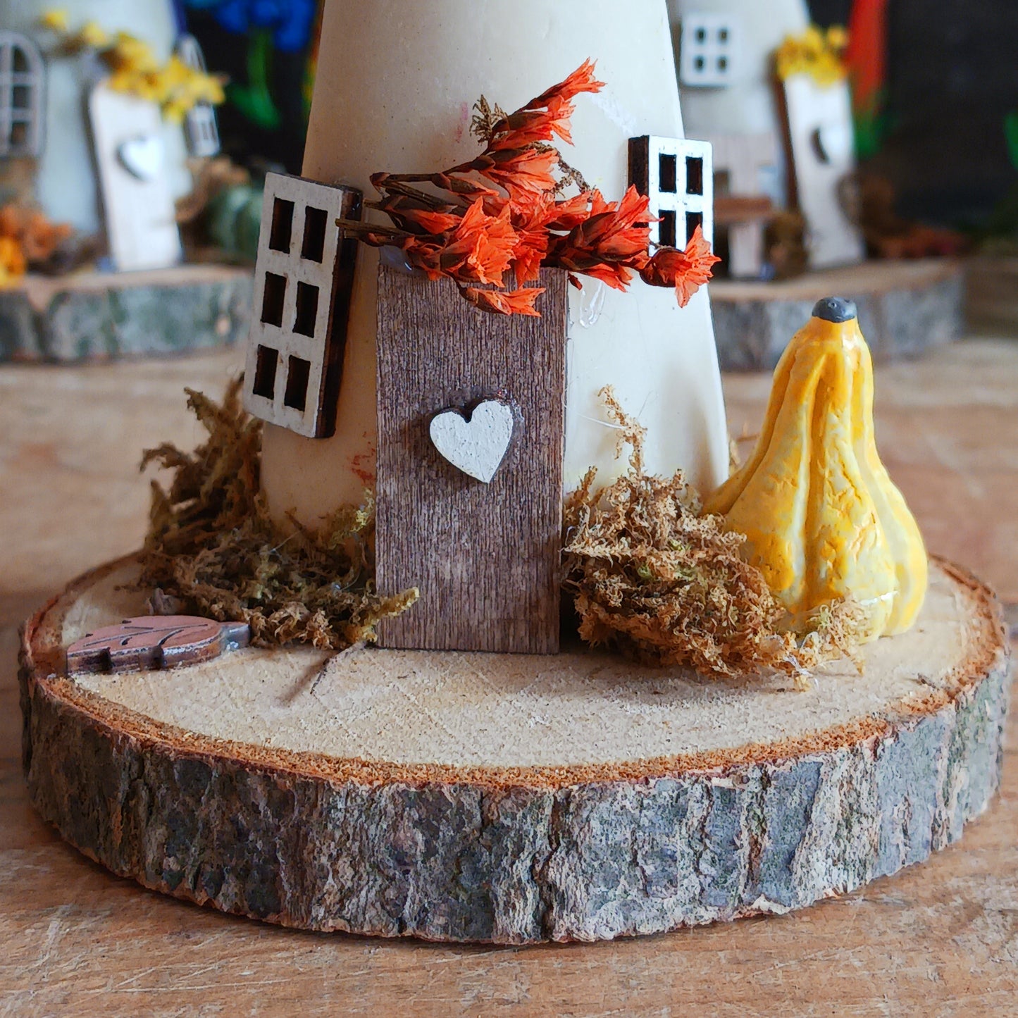 Add a whimsical touch to your home with these charming folk art mushroom cottages. Perfect for all occasions, these handcrafted ornaments are made from high-quality polystone and wood, featuring delightful details and a rustic base made from natural wood slices. Whether placed on a shelf, desk, or windowsill, these miniature cottages bring warmth and personality to any space. Ideal for gifting or as a unique addition to your home décor collection.