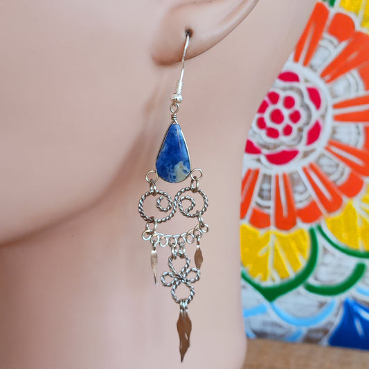 Add a touch of bohemian beauty to your look with these handmade Peruvian stone earrings. Featuring lapis lazuli stones and finished with silver-plated hooks, each pair is carefully crafted in small workshops in Peru.
