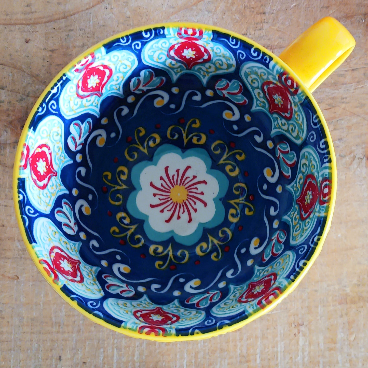 Bring Mediterranean charm to your kitchen with these beautiful Tuscany-inspired ceramic mugs. Featuring a vibrant glaze outside and embossed geometric patterns inside, they capture the rustic warmth of terracotta tiles and intricate murals found in sun-soaked Italian villages. The kaleidoscopic interiors add a burst of artistic flair, making them perfect for your morning coffee or evening tea. Stylish and versatile, these mugs are a thoughtful gift or a delightful treat for yourself.
