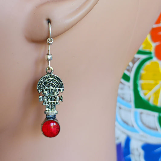 These intricate earrings feature a tiny image of the Tumi, a type of ceremonial knife used in ancient Peru by the Moche culture. They feature a mythical character usually identified with the god Naymlap.