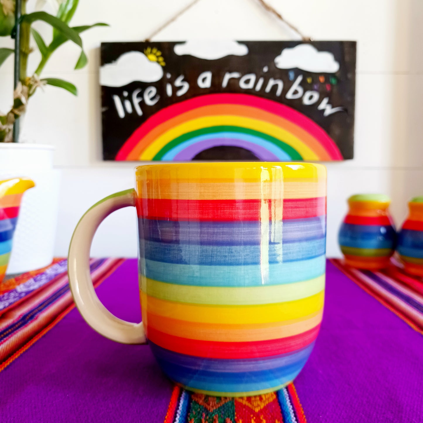 Lovely and colourful rainbow striped mug with a pale green interior. Perfect for every day use at home. The welcoming design is uplifting and contributes to creating a cosy atmosphere. The traditional profile is finished to a shine glaze, beautifully highlighting the vibrant multi colours.