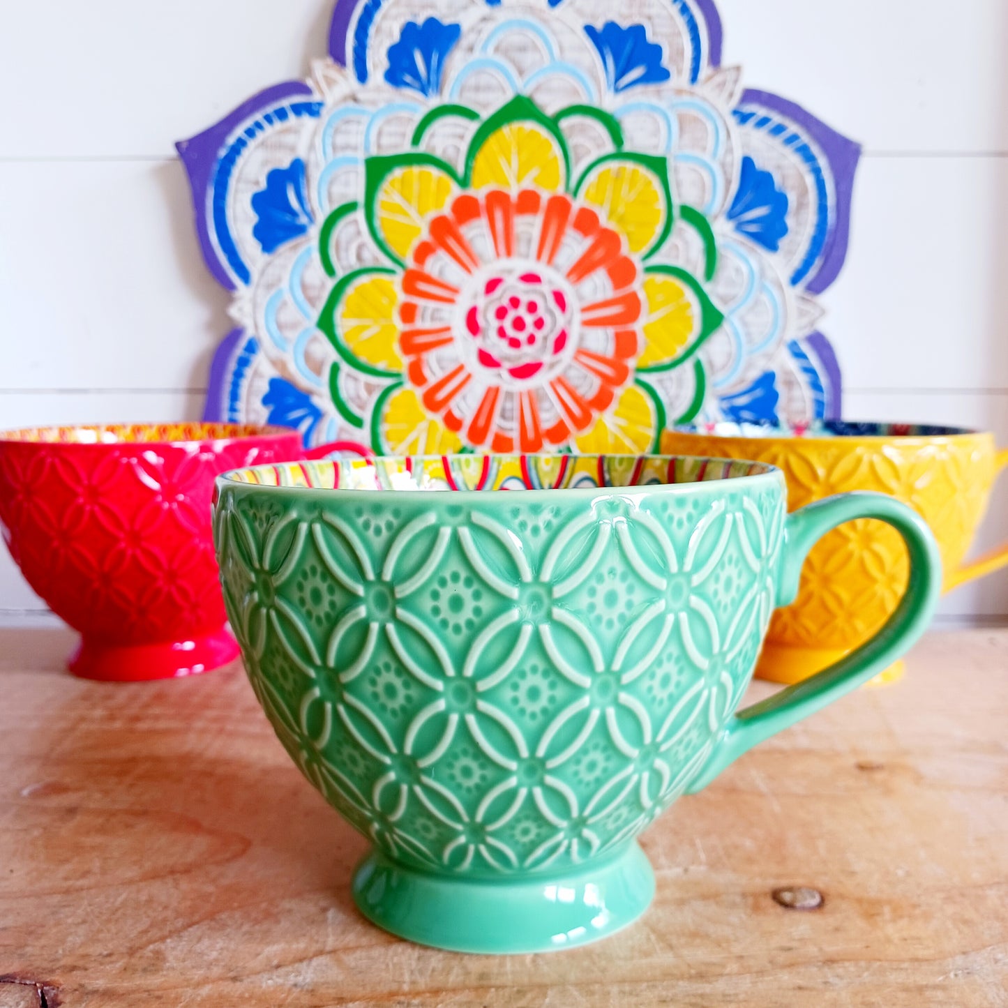 Bring Mediterranean charm to your kitchen with these beautiful Tuscany-inspired ceramic mugs. Featuring a vibrant glaze outside and embossed geometric patterns inside, they capture the rustic warmth of terracotta tiles and intricate murals found in sun-soaked Italian villages. The kaleidoscopic interiors add a burst of artistic flair, making them perfect for your morning coffee or evening tea. Stylish and versatile, these mugs are a thoughtful gift or a delightful treat for yourself.