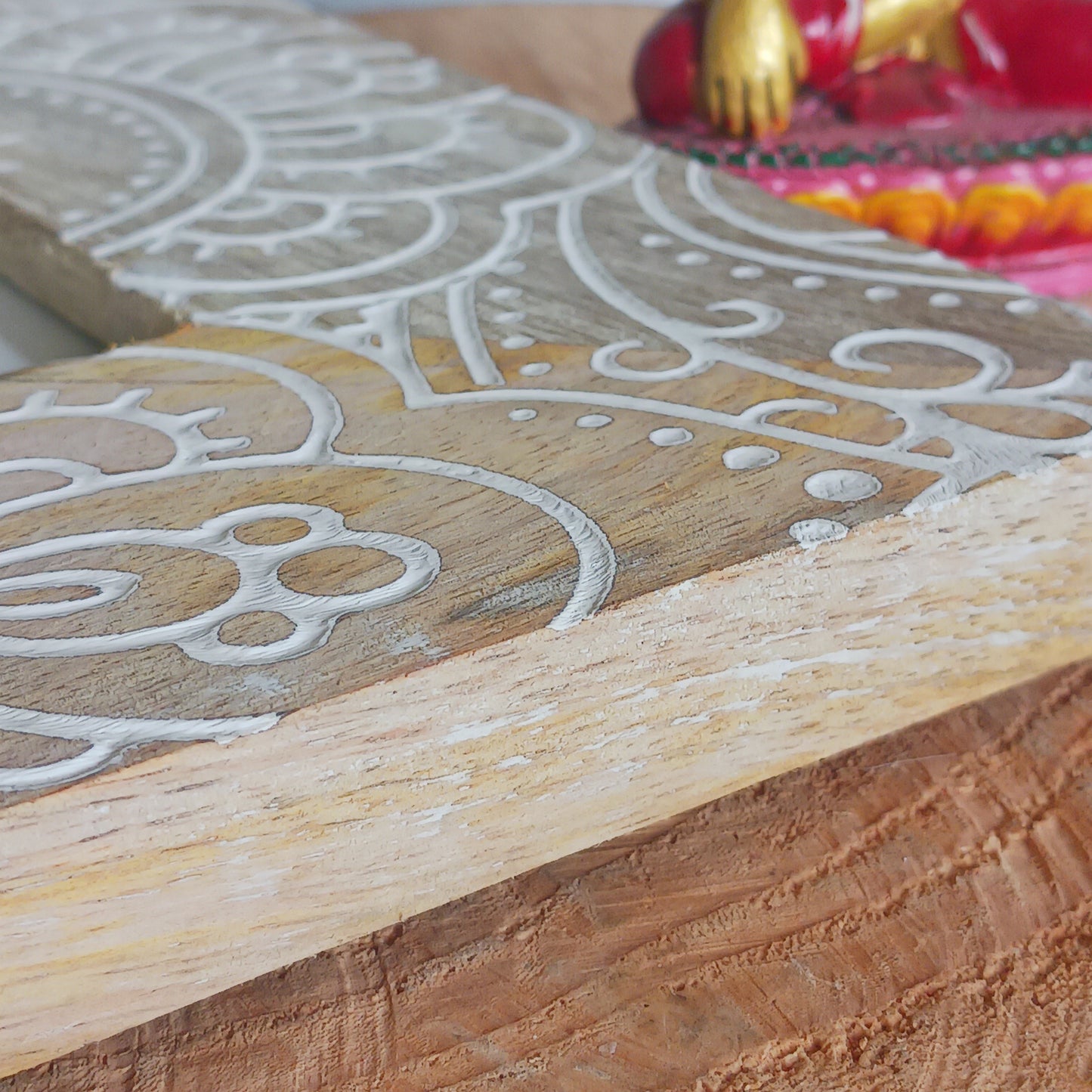 Made in India from sustainably sourced mango wood, these lovely picture frames bring warmth, character, and meaning to any space. Each one is carefully carved or painted with spiritual and cultural designs that go beyond decoration holding deep symbolism and tradition. The small Buddha in the corner is a peaceful presence that represents wisdom and enlightenment. Ideal for meditation spaces, yoga studios, or anyone seeking a sense of calm.