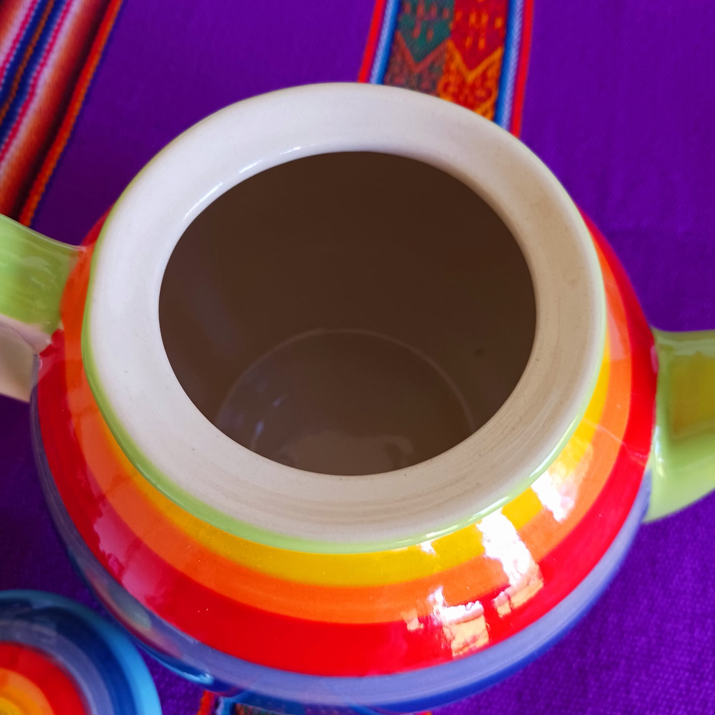 Experience the perfect fusion of artistry and functionality with this exquisite 2-cup ceramic teapot from Thailand. Handcrafted by skilled artisans, this vibrant teapot features a stunning rainbow stripe, adding a pop of colour and charm to your tea rituals.