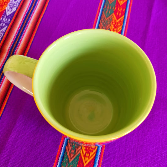 The rainbow stripe on this colourful large mug is hand painted before it is fired and finishes it beautifully. These Thai ceramics are traditionally made, hand painted with a pale green interior and finished to a shine glaze highlighting the vibrant multi colors perfectly.