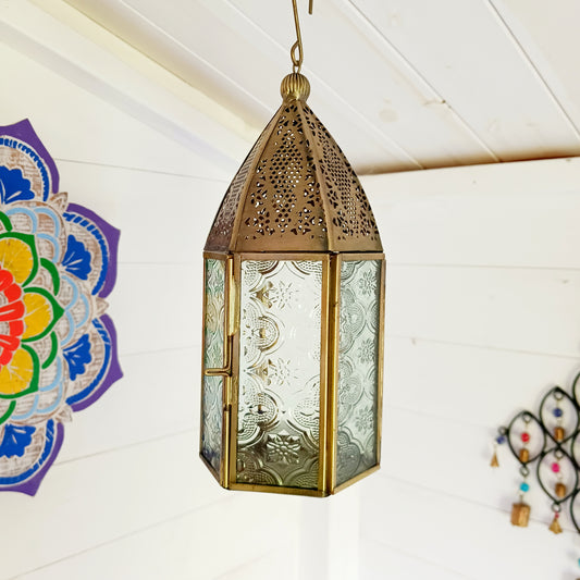 This antique brass Moroccan style large glass lantern has clear embossed glass panes and a wonderful antique finish. A stylish and versatile addition to any home, this beautiful lantern is ideal to bright up your home.