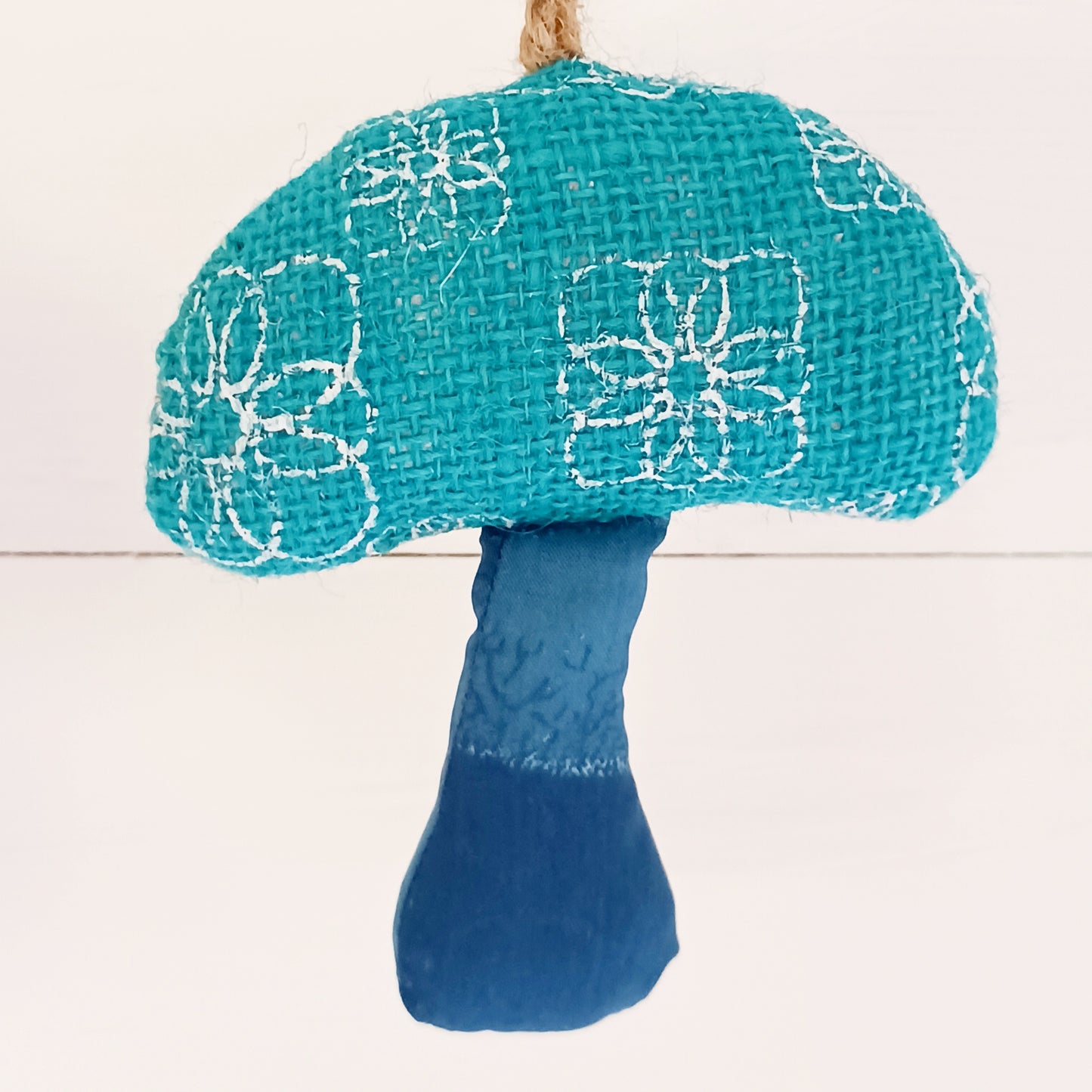 These decorative hanging toadstool garlands will brighten up your home and garden. Handmade in Bangladesh, each of these fun garlands are unique.