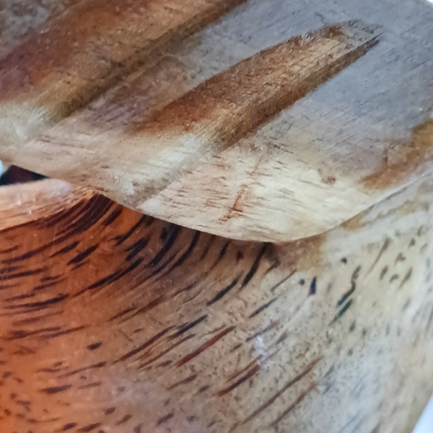 Bring a touch of whimsy and natural beauty to your home with this Handcarved Wooden Flying Duck. Each piece is meticulously crafted from solid wood, showcasing the artisan’s skill and attention to detail. The duck’s natural finish highlights the unique wood grain, adding a rustic charm that complements any interior style.