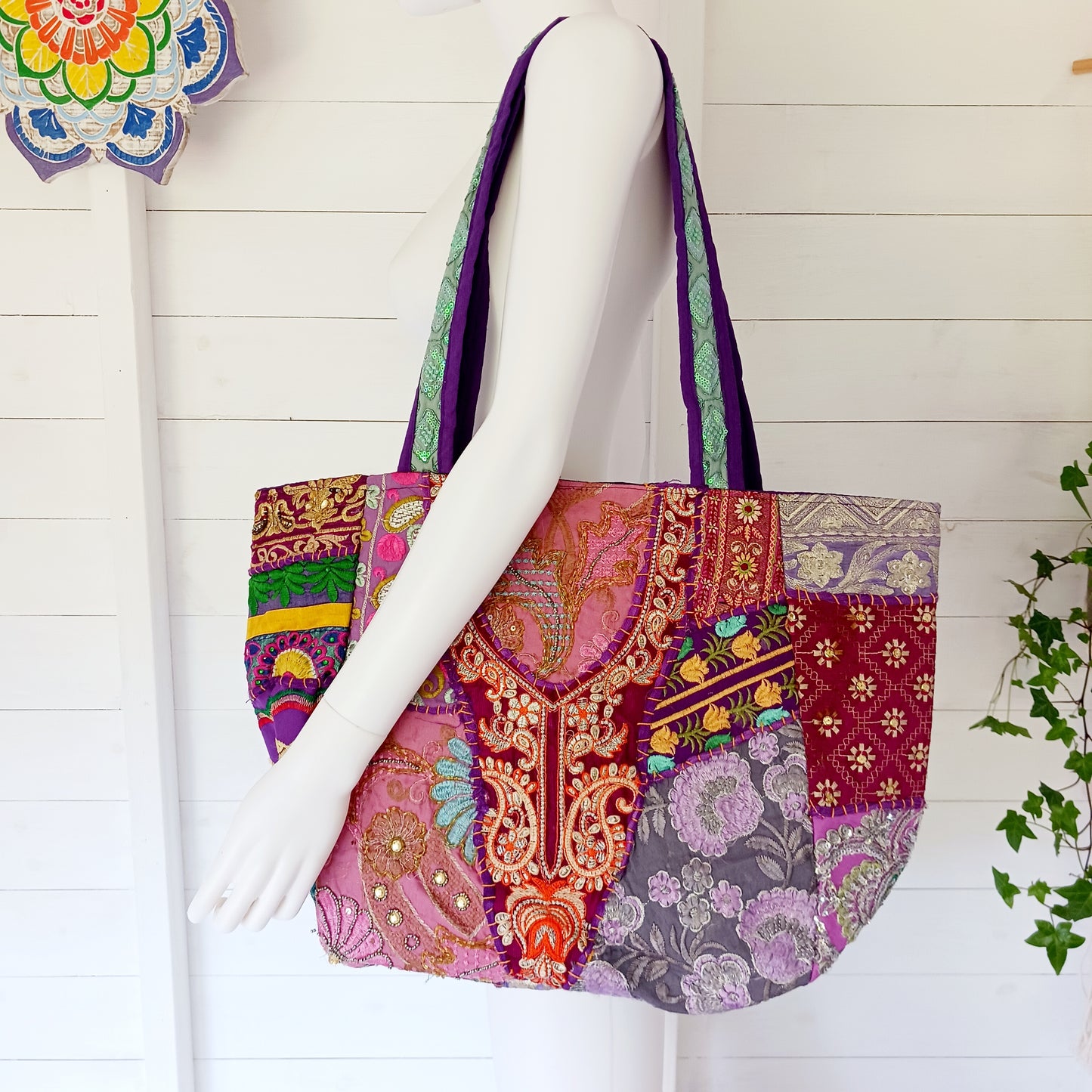This beautiful large Indian bag comes with a wide shoulder strap and plenty of space inside for your personal items. In a patchwork style design, this bag is intricately embroidered with a traditional bohemian pattern. The bag is fully lined throughout.