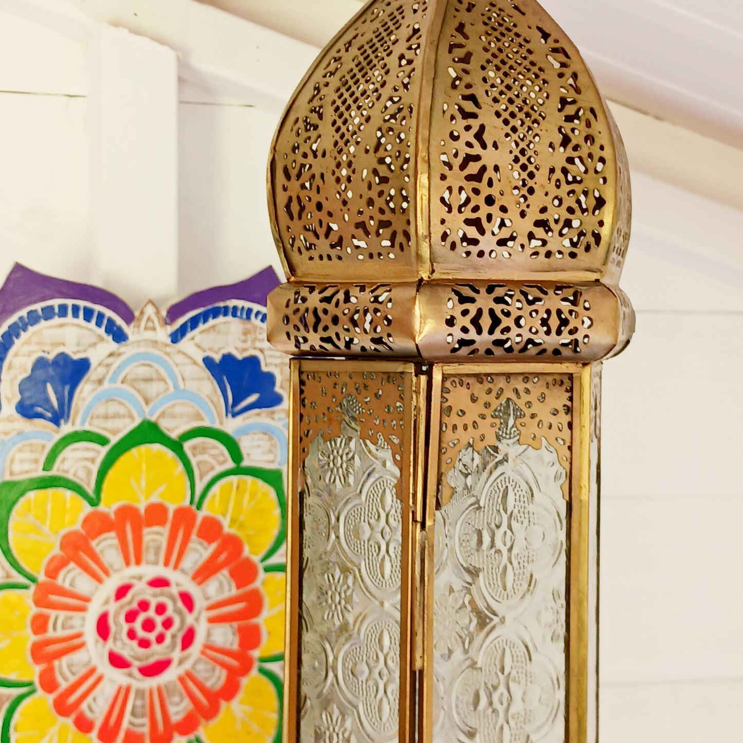 This antique brass Moroccan style large glass lantern has clear embossed glass panes and a wonderful antique finish. A stylish and versatile addition to any home, this beautiful lantern is ideal to bright up your home.