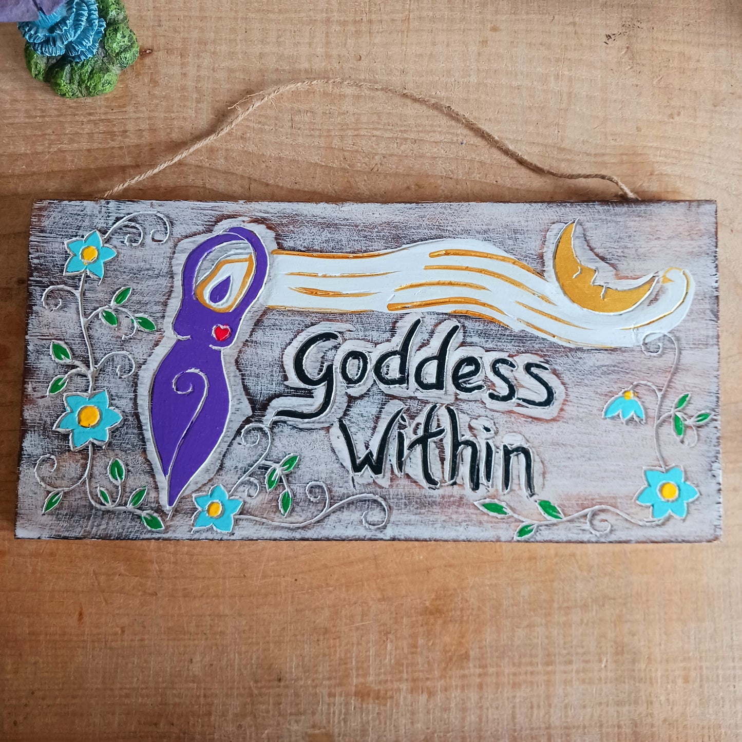 Celebrate your inner strength and feminine energy with this handmade rustic plaque, etched with the empowering message: "Goddess Within" and a beautifully detailed goddess figure. Crafted with care and finished with a sturdy, thick twine cord, this charming piece is perfect for hanging on walls, doors, sheds, or even trees. Whether indoors or out, it's a magical touch for any sacred space or nature-inspired decor.
