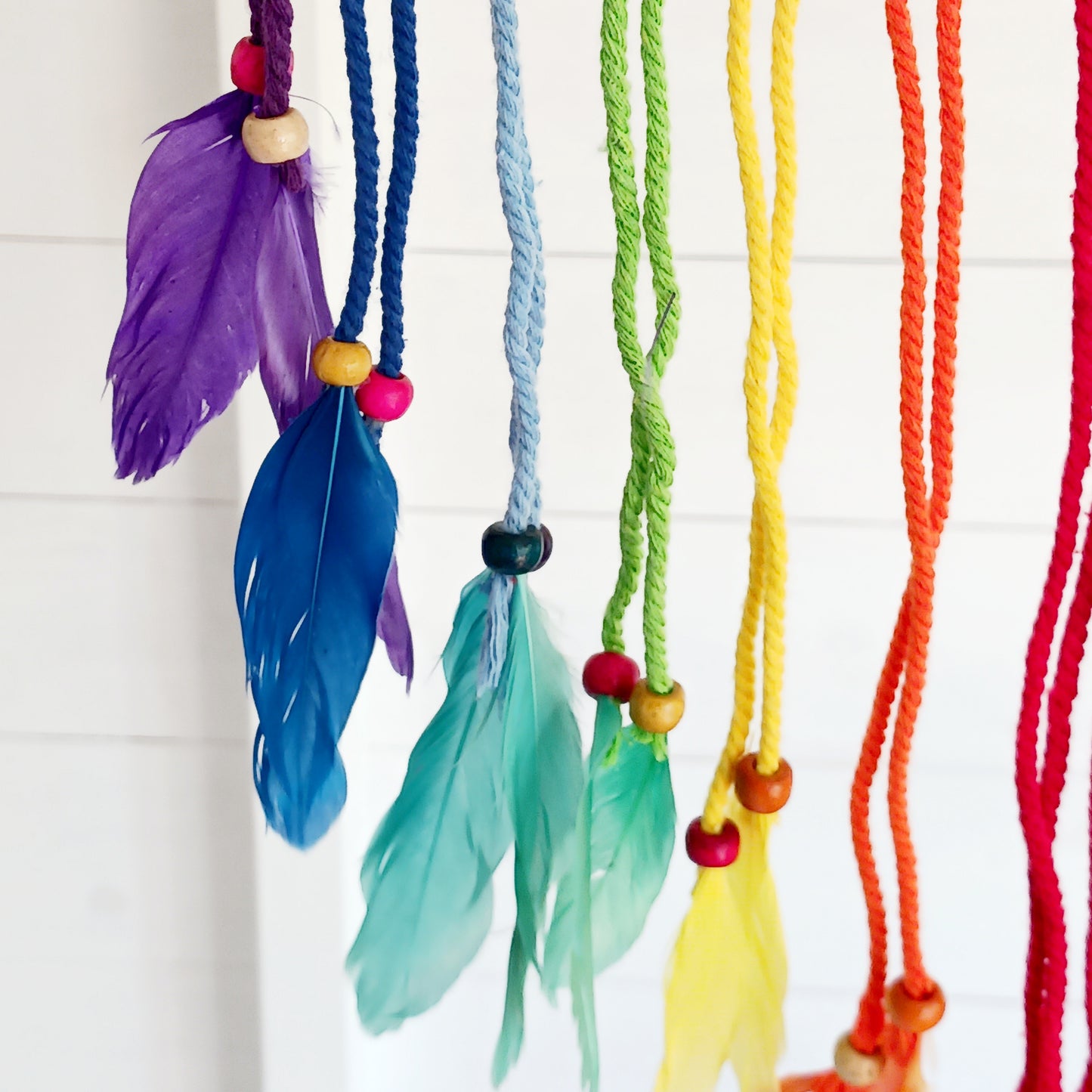 Bring harmony, colour, and positive energy into your space with this large, vibrant dreamcatcher. Featuring seven small hoops representing each of the chakras, this stunning piece is hand-crafted with bright rainbow crocheting. Ideal as a wall hanging, it makes a thoughtful gift for yoga lovers, meditation enthusiasts, or anyone seeking balance and wellbeing. Perfect for adding a spiritual touch to your home décor while promoting peace and positivity.