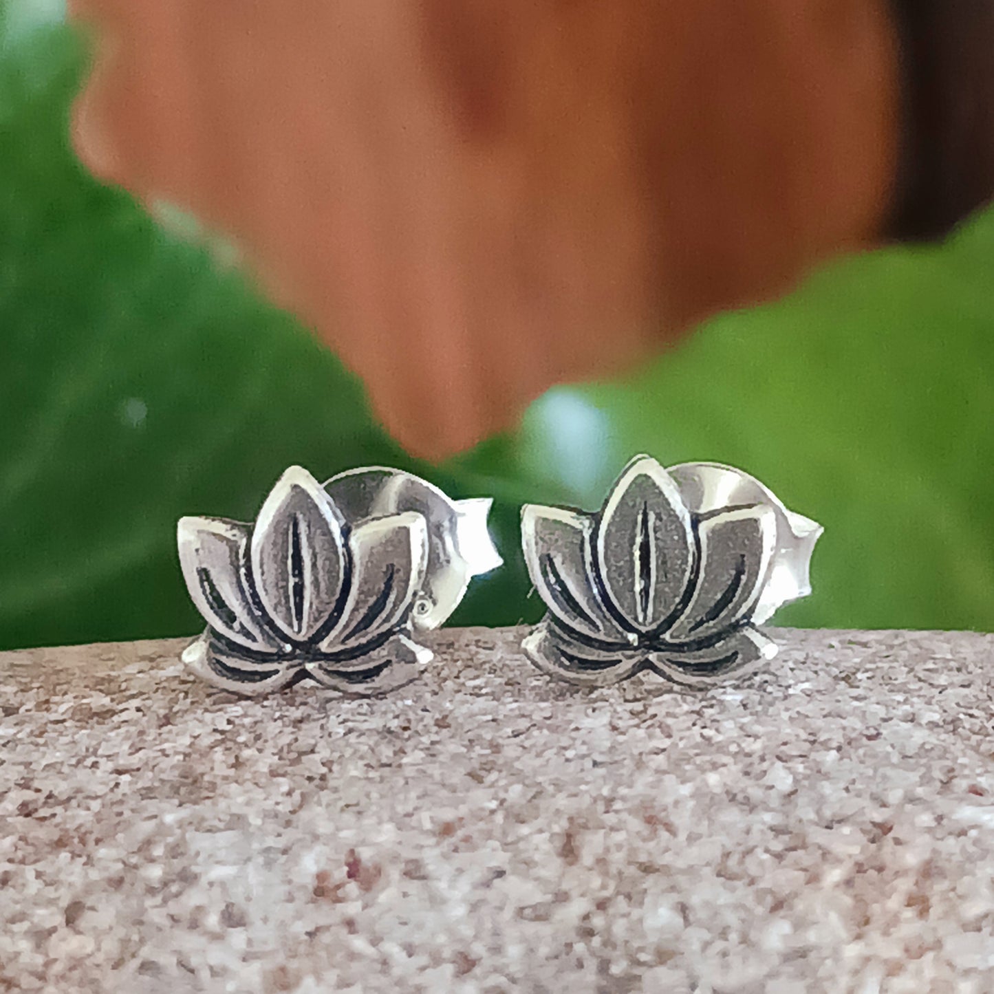 Make a subtle yet stylish statement with these beautiful Lotus Flower 925 Sterling Silver Ear Studs. Crafted with care from 925 silver, these graceful earrings add a touch of sophistication to any look.