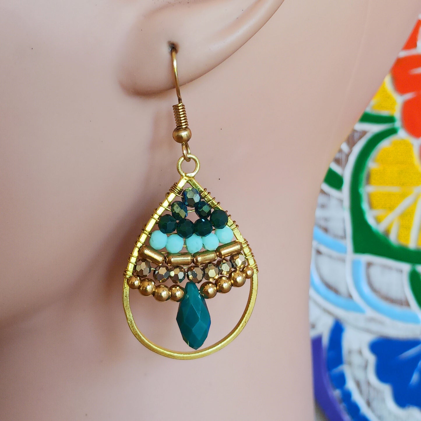 These pretty beaded earrings are so bohemian chic and add effortless style to your outfit. The beads sparkle gently when the light catches them, making them a great evening accessory as well as daytime. They are finished with gold plated hooks.