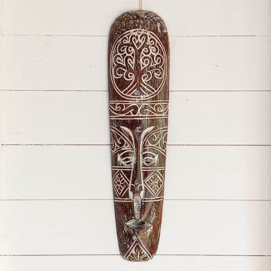 Bring the spirit of Celtic heritage into your home with this beautifully hand-carved Celtic wooden mask, featuring intricate knotwork and a Tree of Life pattern that symbolize eternity, unity, and tradition. Designed for lovers of cultural art and meaningful decor, this striking wall piece adds depth, character, and history to any space.