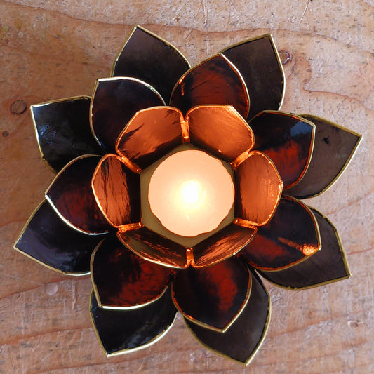 The Lotus Flower is a symbol of achieving enlightenment, peacefulness and spirituality. This beautiful candle holder can be fitted with tealight candles or slightly larger candles. The diameter of the middle is roughly 5.5cm, so it will fit any candle with the same diameter.
