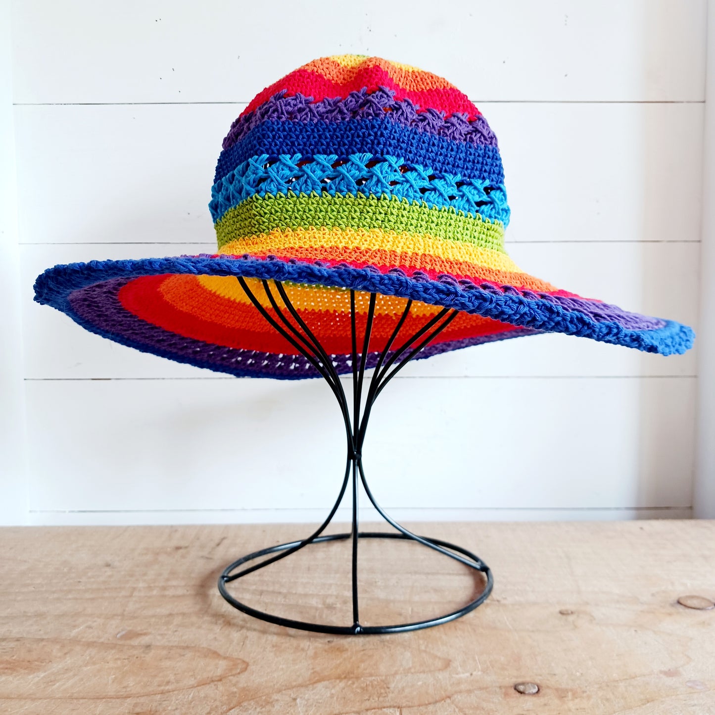 Handmade rainbow crochet sun hat with a flexible brim. Perfect for holidays, beach days & festivals. Unique, lightweight, and ready for sunny adventures!