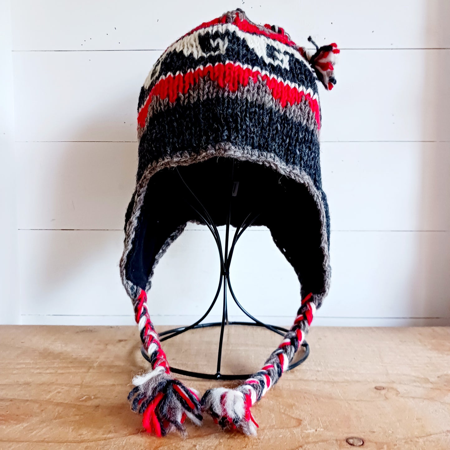 Stay cozy and stylish with our handmade chunky wool earflap hats, crafted in Nepal by skilled women artisans in Kathmandu. Each hat is 100% pure wool and features a soft polar fleece lining for extra warmth and comfort. Perfect for cold winter days, outdoor adventures, or adding a touch of handmade charm to your look.