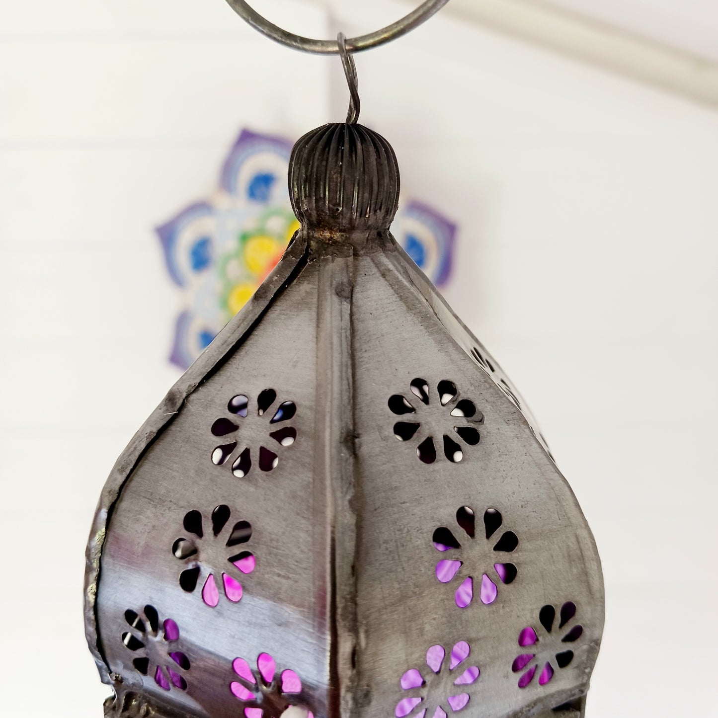 These small glass lanterns come in wonderful colours, featuring an intricate embossed pattern. They have a small hinged door that closes with a sliding catch. The small handle on the top is great for hanging the lanterns around your home. Perfect for adding a touch of warmth to your space.