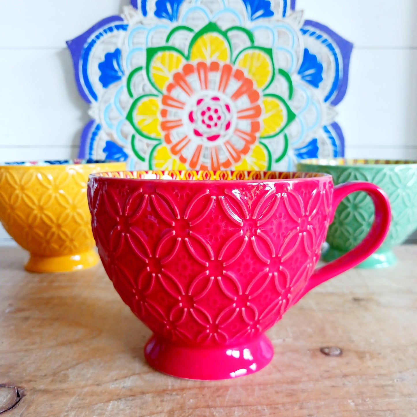 Bring Mediterranean charm to your kitchen with these beautiful Tuscany-inspired ceramic mugs. Featuring a vibrant glaze outside and embossed geometric patterns inside, they capture the rustic warmth of terracotta tiles and intricate murals found in sun-soaked Italian villages. The kaleidoscopic interiors add a burst of artistic flair, making them perfect for your morning coffee or evening tea. Stylish and versatile, these mugs are a thoughtful gift or a delightful treat for yourself.