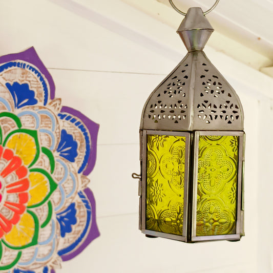 These small glass lanterns come in wonderful colours, featuring an intricate embossed pattern. They have a small hinged door that closes with a sliding catch. The small handle on the top is great for hanging the lanterns around your home. Perfect for adding a touch of warmth to your space.
