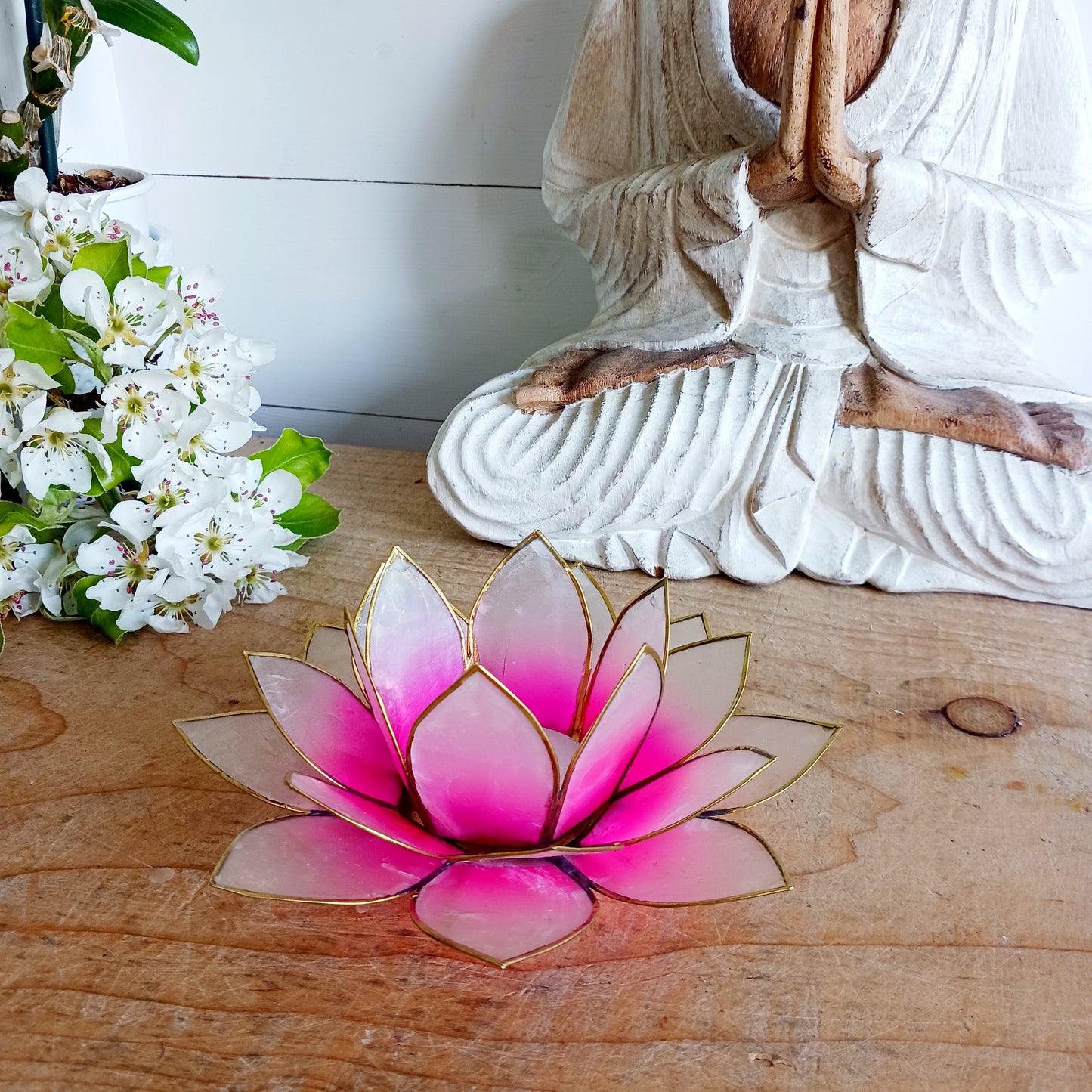 The Lotus Flower is a symbol of achieving enlightenment, peacefulness and spirituality. This beautiful candle holder can be fitted with tealight candles or slightly larger candles. The diameter of the middle is roughly 5.5cm, so it will fit any candle with the same diameter.