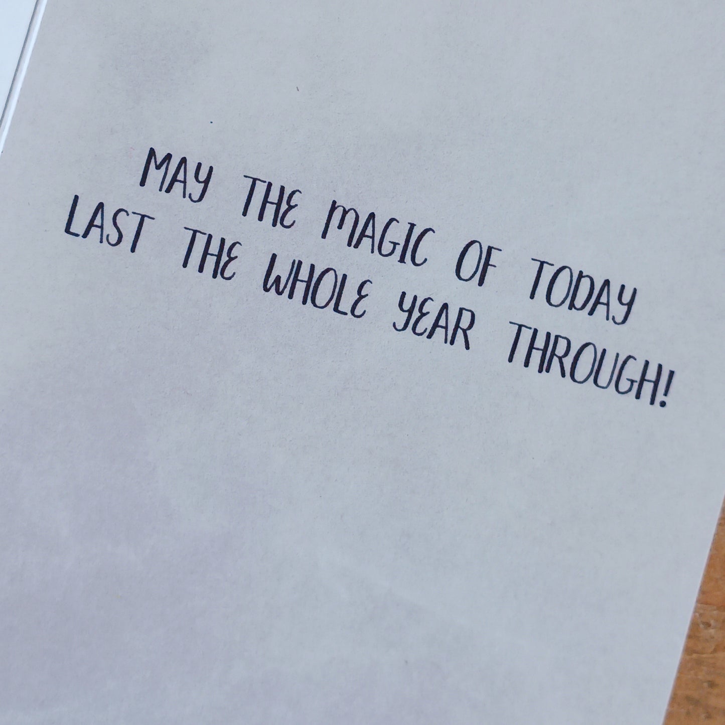 Magical wishes greetings card for birthday. Inside the message reads: May the magic of today last the whole year through! The card comes with an illustrated envelope. Each card also has faint artwork inside.