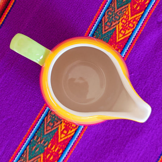 This rainbow stripe ceramic milk jug will brighten up any home. The vibrant stripes are hand painted giving each piece individual character.