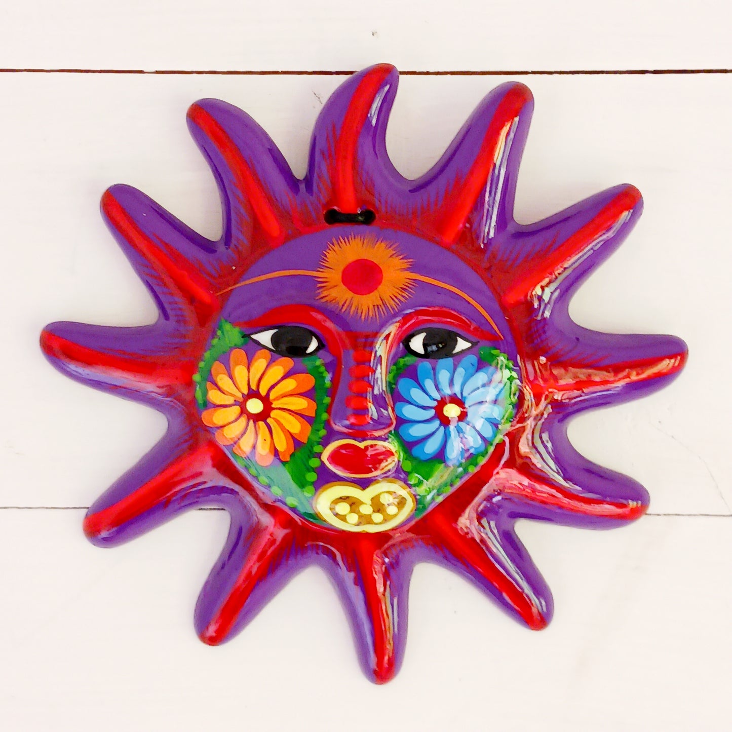 Add a burst of colour with this vibrant, hand-painted Xalitla wall plaque. Traditional Mexican folk art with a glossy finish and easy hanging design.