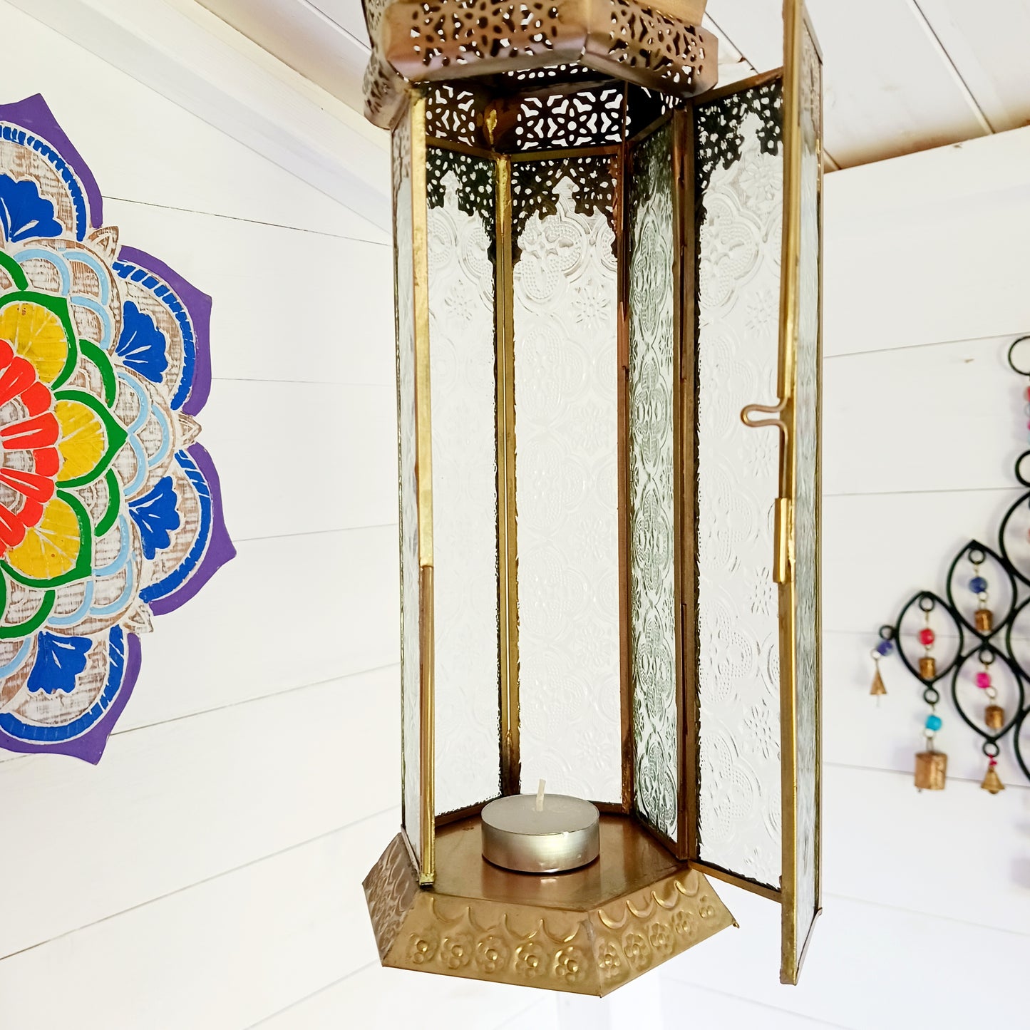 This antique brass Moroccan style large glass lantern has clear embossed glass panes and a wonderful antique finish. A stylish and versatile addition to any home, this beautiful lantern is ideal to bright up your home.
