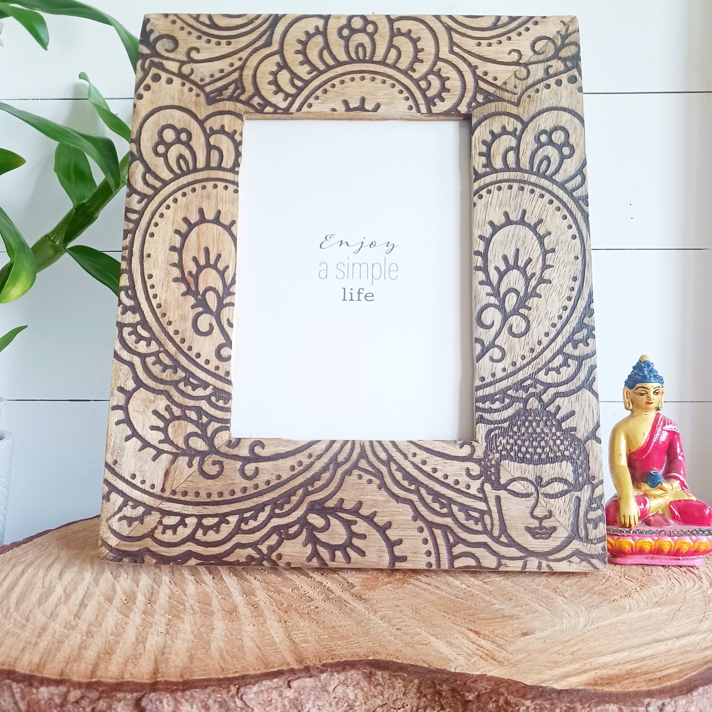 Made in India from sustainably sourced mango wood, these lovely picture frames bring warmth, character, and meaning to any space. Each one is carefully carved or painted with spiritual and cultural designs that go beyond decoration holding deep symbolism and tradition. The small Buddha in the corner is a peaceful presence that represents wisdom and enlightenment. Ideal for meditation spaces, yoga studios, or anyone seeking a sense of calm.