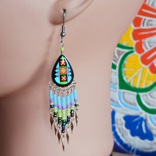 Add a touch of artisan elegance to your jewellery collection with these stunning handmade Peruvian Incan teardrop earrings. Carefully crafted in small family-run workshops in Peru, these eye-catching earrings feature traditional Incan-inspired patterns on the front with a contrasting black reverse for a striking finish.