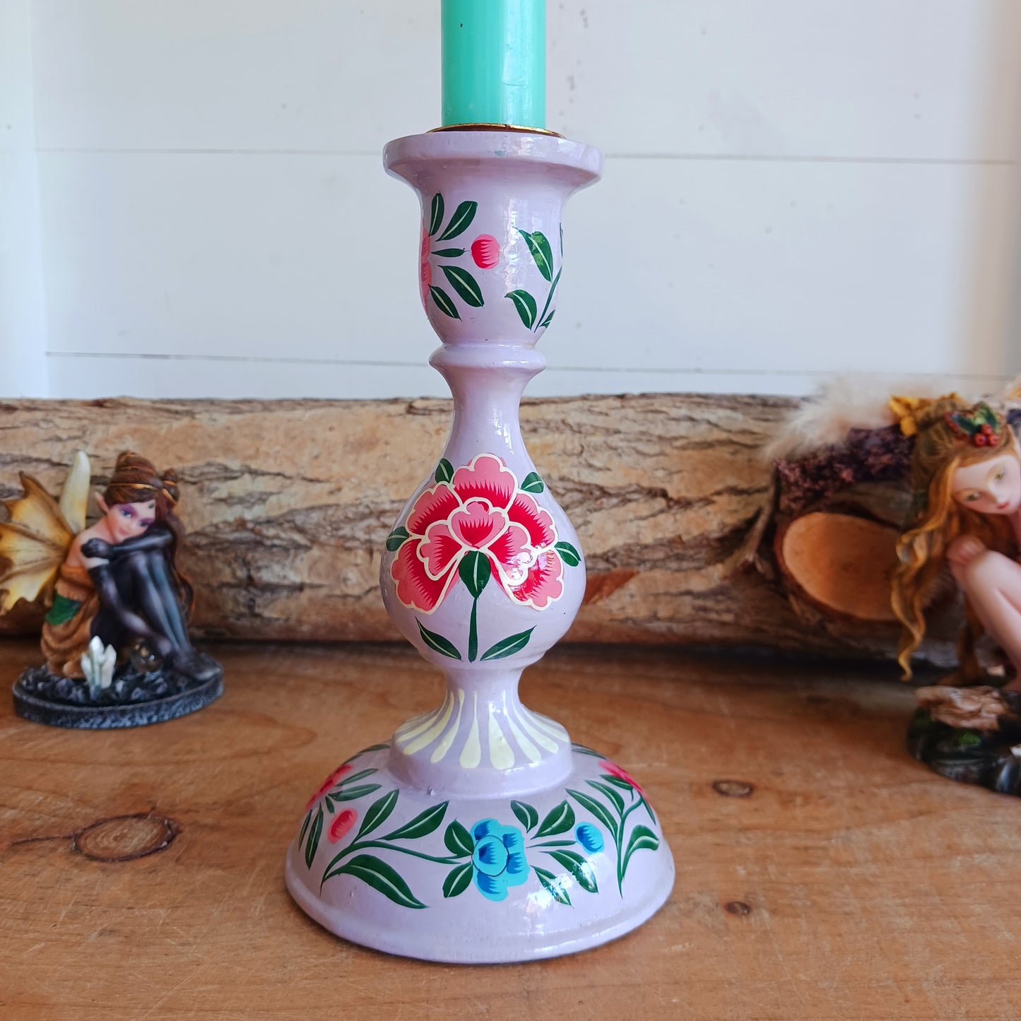 These beautifully hand crafted Kashmiri candle holders have been hand painted in four vibrant, decorative colours of purple, pink, yellow and turquoise.  These unique candlesticks will fill any space with elegant grandeur.  Intricate flower petals and delicate foliage are finished to a high shine glaze to boost the intensity of a captivating design.