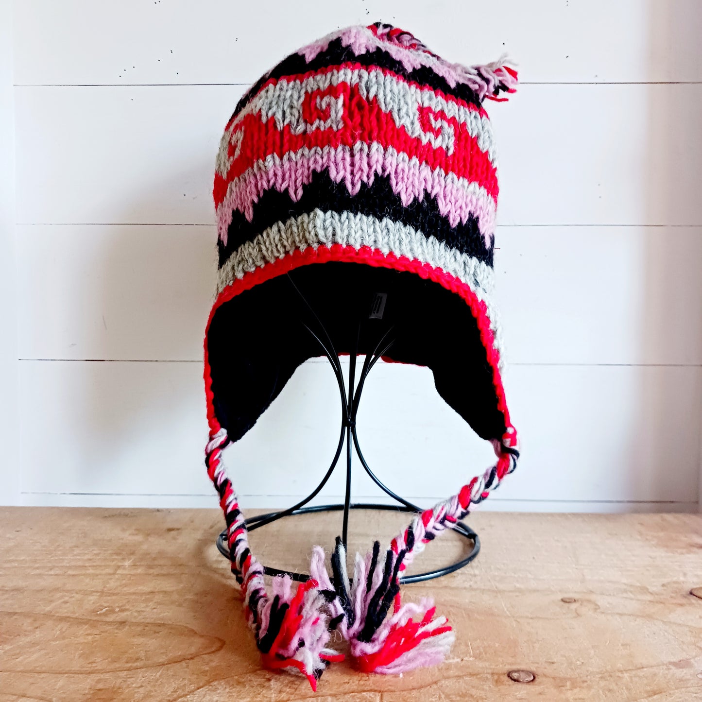 Stay cozy and stylish with our handmade chunky wool earflap hats, crafted in Nepal by skilled women artisans in Kathmandu. Each hat is 100% pure wool and features a soft polar fleece lining for extra warmth and comfort. Perfect for cold winter days, outdoor adventures, or adding a touch of handmade charm to your look.