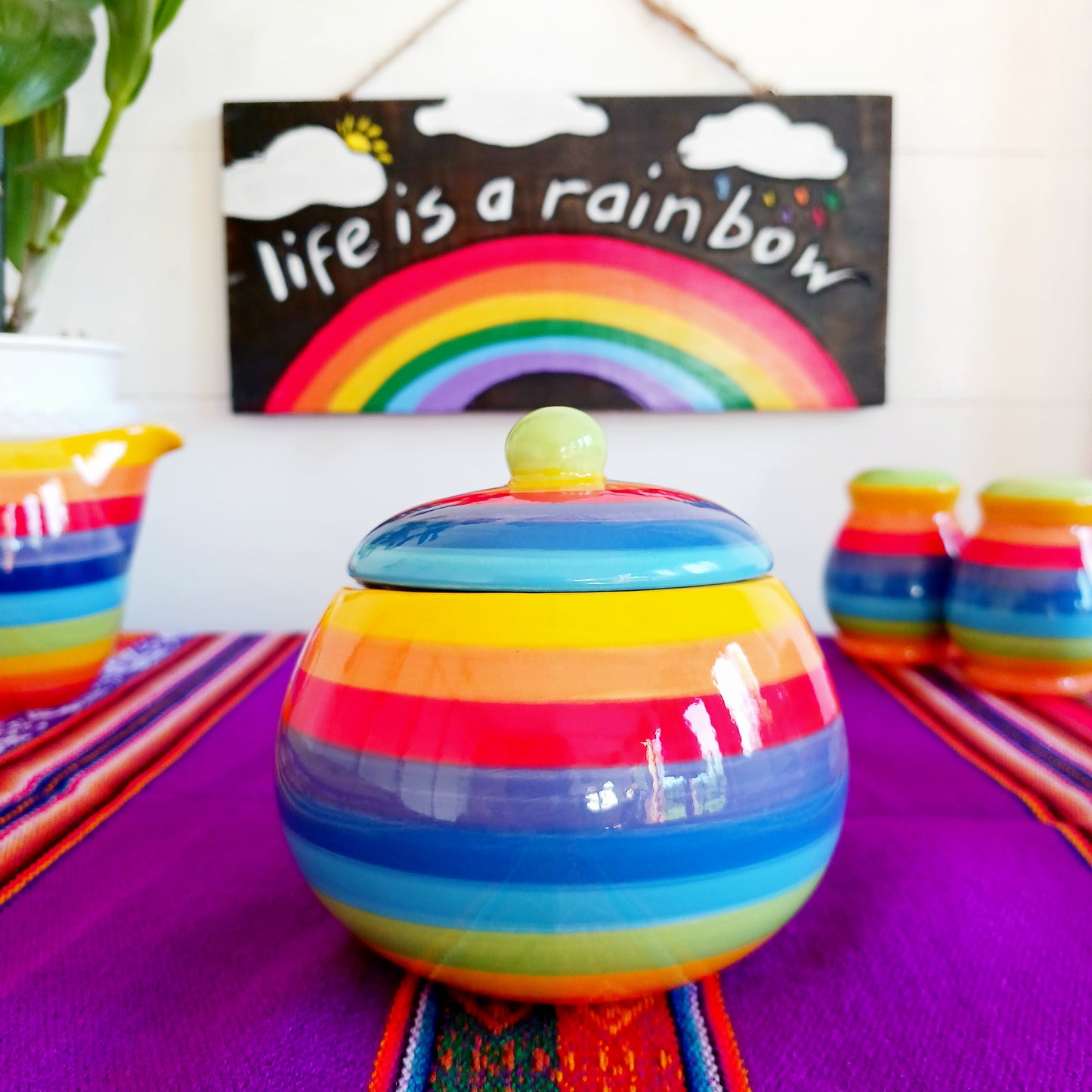 Add a splash of colour to your home with this Rainbow Stripe Ceramic Sugar Bowl. The vibrant, hand-painted stripes create a cheerful aesthetic, while the artisanal craftsmanship ensures every piece is uniquely charming. Perfect for serving sugar or small treats, this sugar bowl brightens any table setting.