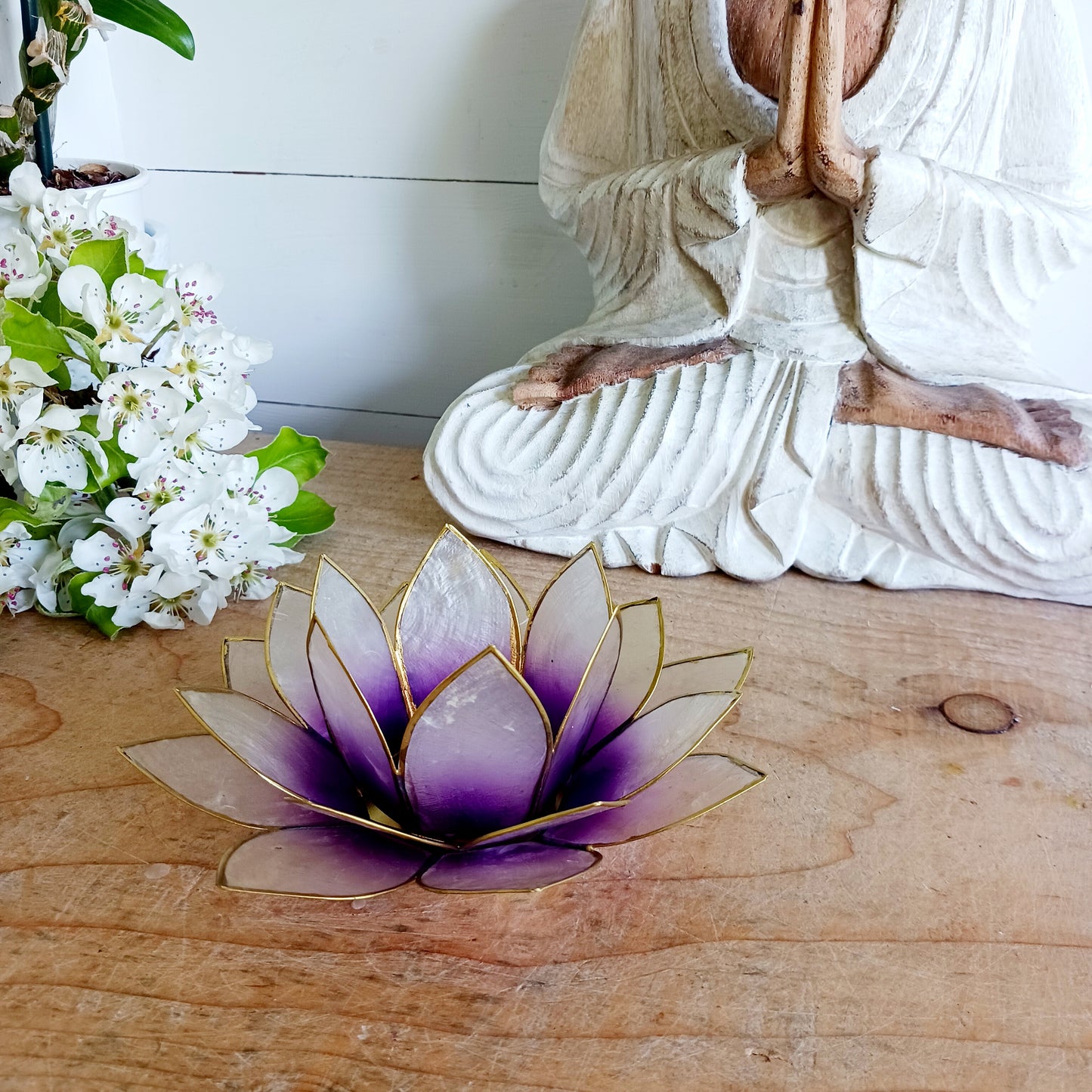The Lotus Flower is a symbol of achieving enlightenment, peacefulness and spirituality. This beautiful candle holder can be fitted with tealight candles or slightly larger candles. The diameter of the middle is roughly 5.5cm, so it will fit any candle with the same diameter.