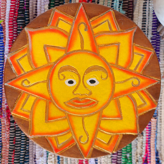 This lovely little handmade, carved and painted stool is Fairtrade from Thailand. It features a vibrant, radiant sun carving with beautiful gold detailing. These cheeky little items are very versatile making great stools for little bums or as tiny tables to add accent to your home. They can also be very useful as a step for those hard to reach high up shelves or even just to put your feet up on, and due to their small form are easy to store.