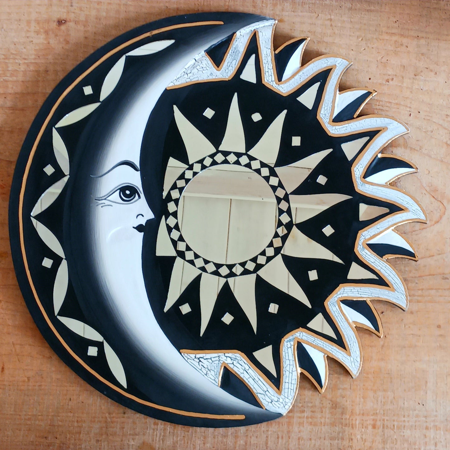Bring the power of the sun and moon into your home with this stunning mirror. This unique eco-friendly piece allows you to express your spiritual side and add a vibrant touch to any space with silver hues echoing the brightness of solar and lunar energy. It's quirky, eclectic and great for a fresh bit of decor.
