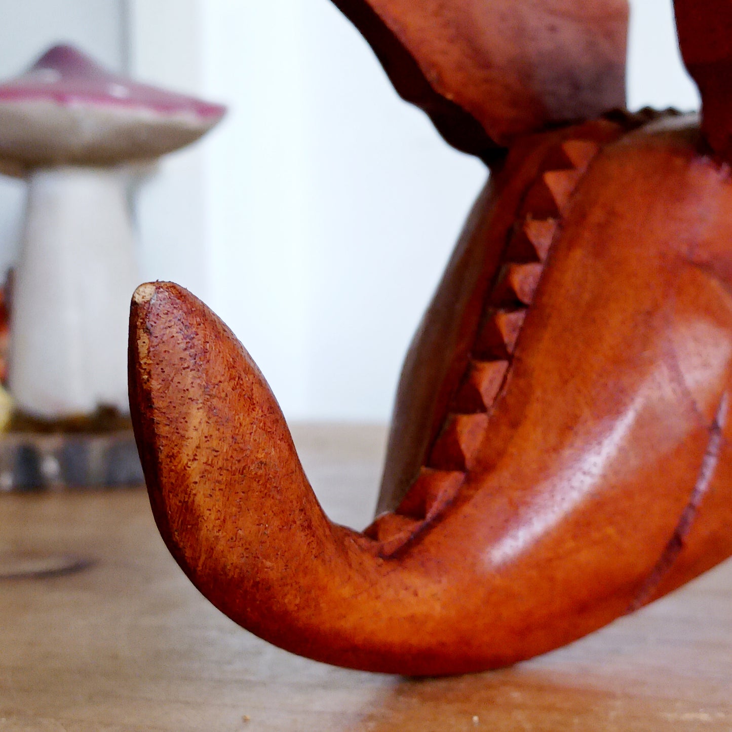 Bring personality and charm into your home with this beautiful hand-carved Shelf Dragon. Expertly crafted with intricate details, this whimsical dragon is designed to perch perfectly on any shelf, mantle, or display space. Its expressive features, artisan carving, and warm natural wood finish make it a captivating accent piece for fantasy lovers, collectors, and anyone who appreciates unique décor.