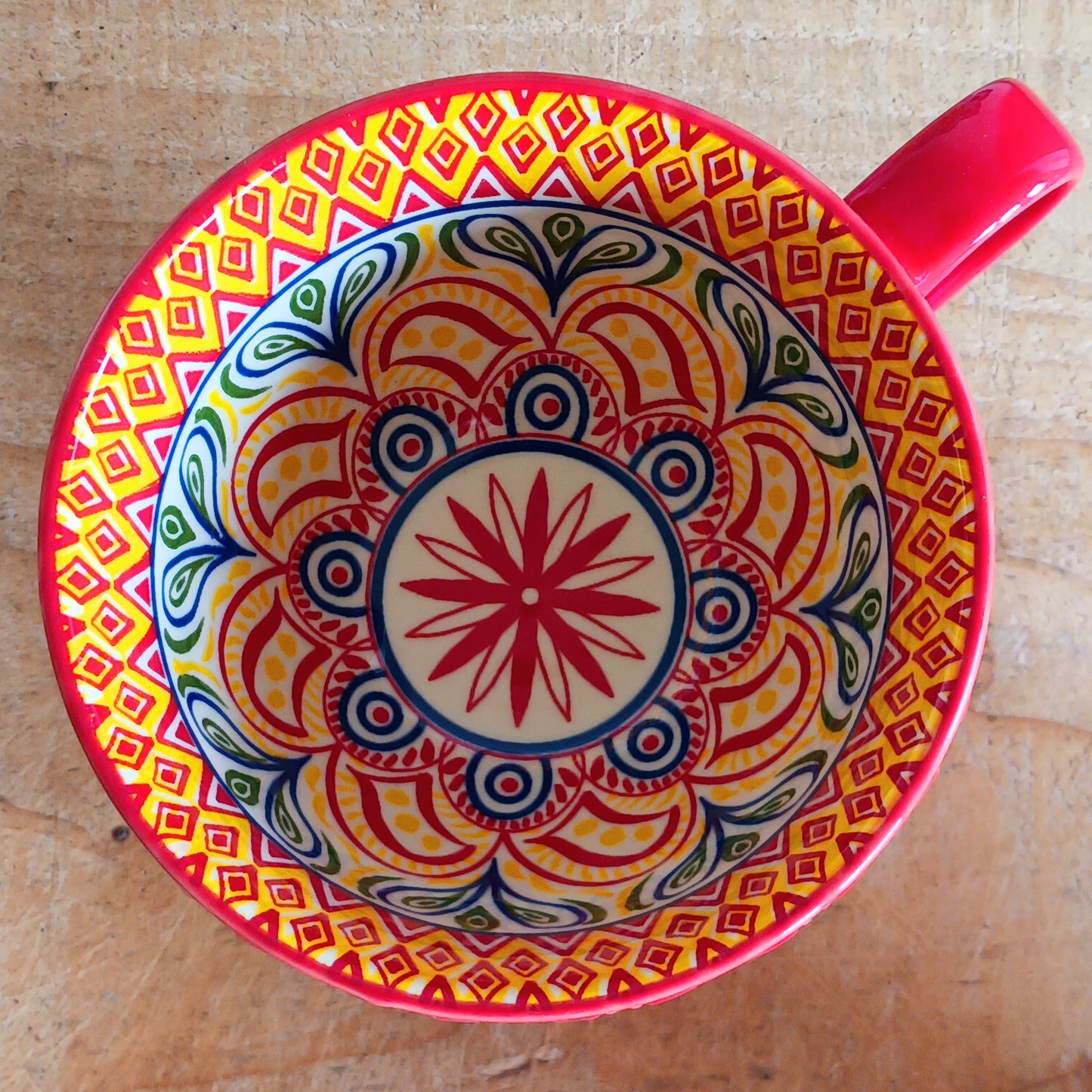 Bring Mediterranean charm to your kitchen with these beautiful Tuscany-inspired ceramic mugs. Featuring a vibrant glaze outside and embossed geometric patterns inside, they capture the rustic warmth of terracotta tiles and intricate murals found in sun-soaked Italian villages. The kaleidoscopic interiors add a burst of artistic flair, making them perfect for your morning coffee or evening tea. Stylish and versatile, these mugs are a thoughtful gift or a delightful treat for yourself.