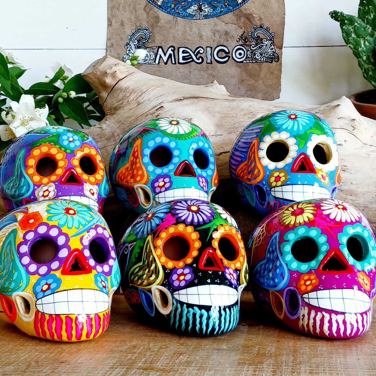 These fun ceramic sugar skull ornaments have been beautifully painted in bright colours and finished with a high shine glaze. They are a popular item during Día de Los Muertos or Day of the Dead festivities, held in Mexico every November to celebrate welcoming the souls of their deceased relatives back for a time of food, drink and celebration.