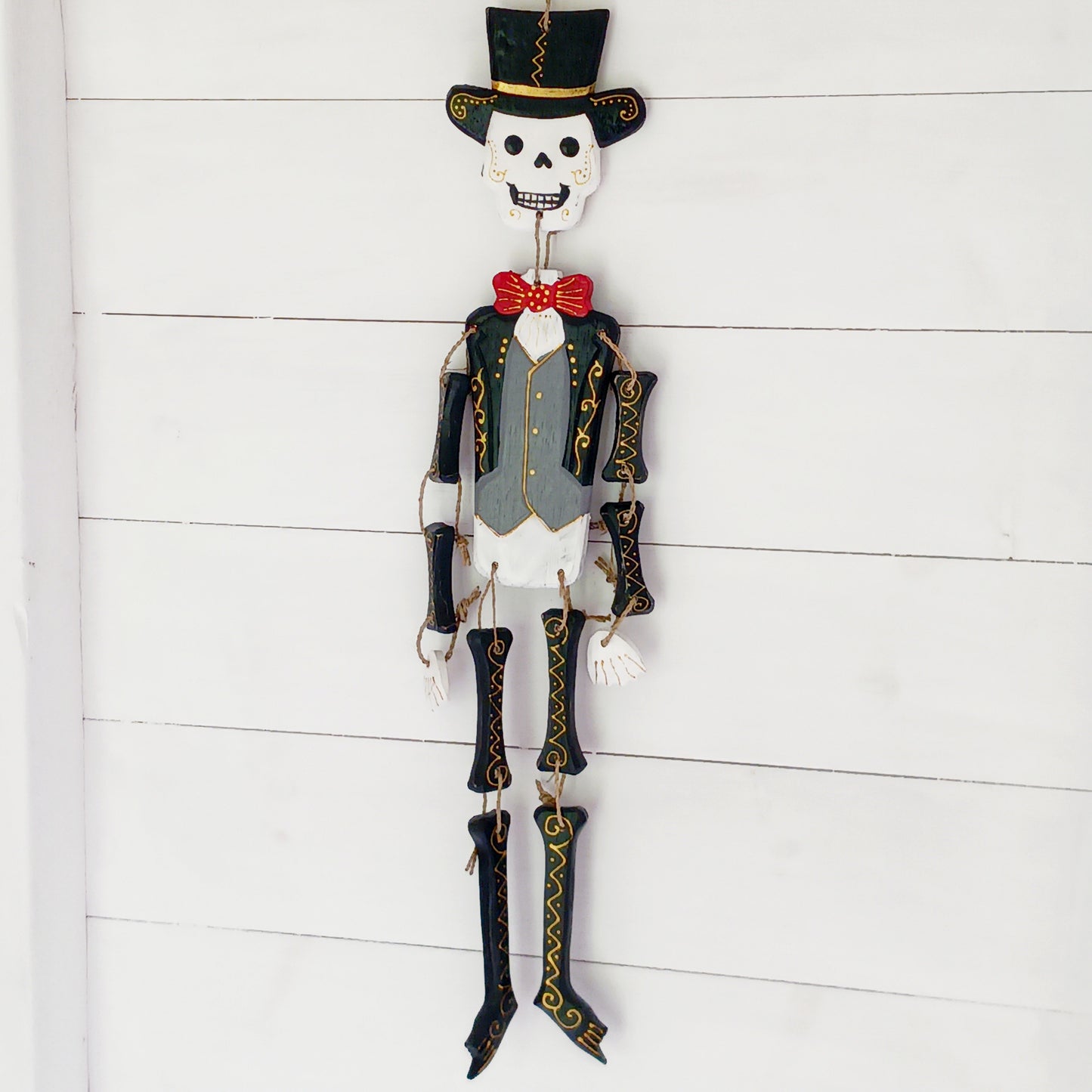 Hand-painted Day of the Dead skeleton inspired by Mexican calaveras. Handmade in Bali. A unique decorative piece for home or Día de los Muertos.