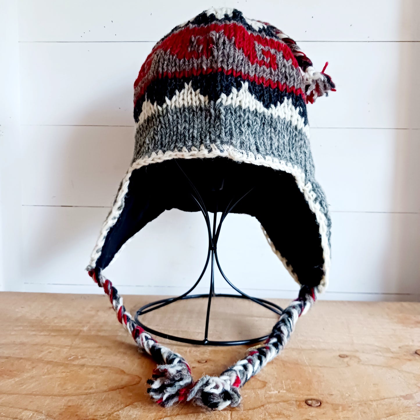 Stay cozy and stylish with our handmade chunky wool earflap hats, crafted in Nepal by skilled women artisans in Kathmandu. Each hat is 100% pure wool and features a soft polar fleece lining for extra warmth and comfort. Perfect for cold winter days, outdoor adventures, or adding a touch of handmade charm to your look.