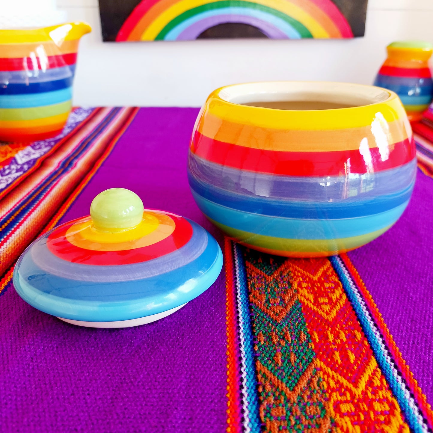 Add a splash of colour to your home with this Rainbow Stripe Ceramic Sugar Bowl. The vibrant, hand-painted stripes create a cheerful aesthetic, while the artisanal craftsmanship ensures every piece is uniquely charming. Perfect for serving sugar or small treats, this sugar bowl brightens any table setting.