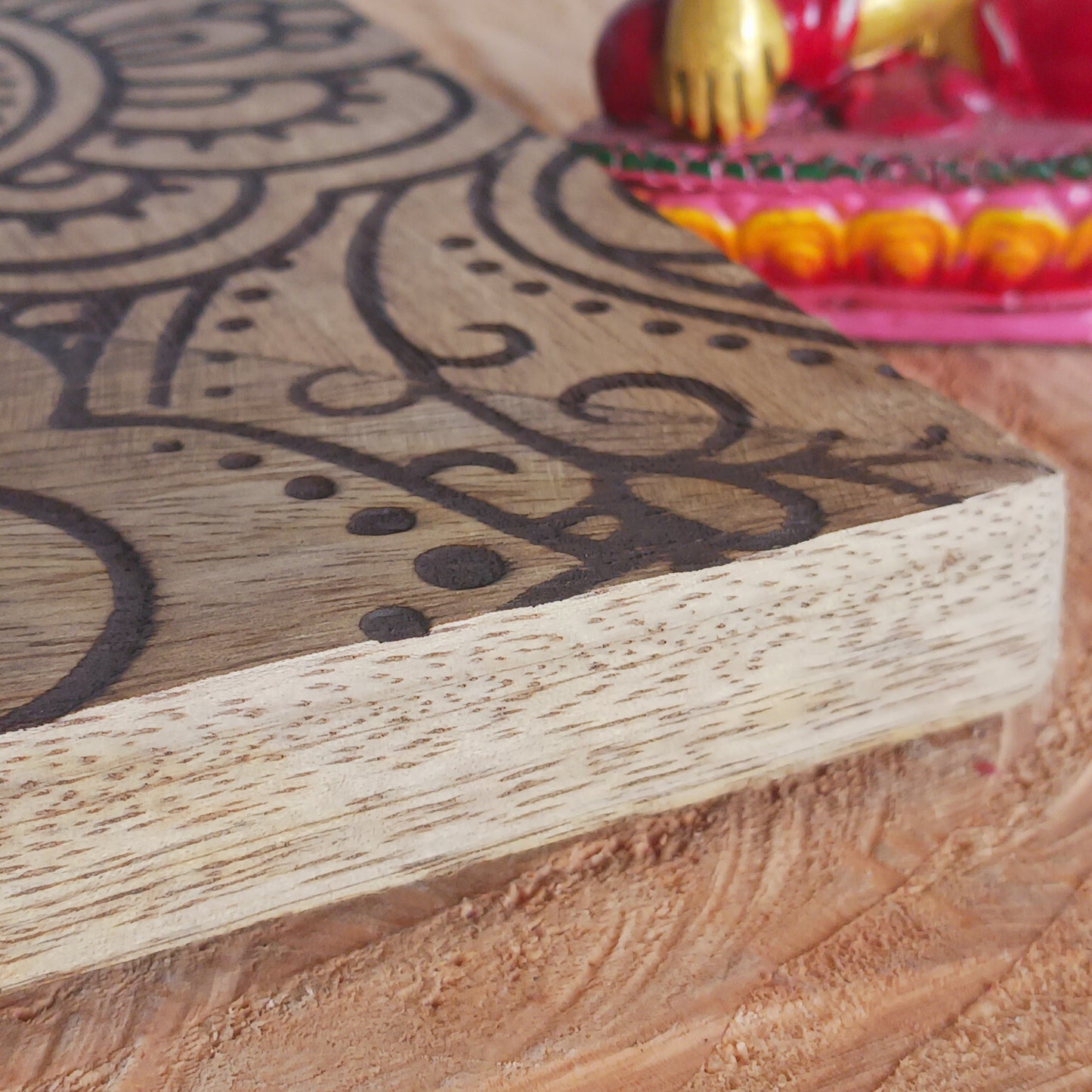 Made in India from sustainably sourced mango wood, these lovely picture frames bring warmth, character, and meaning to any space. Each one is carefully carved or painted with spiritual and cultural designs that go beyond decoration holding deep symbolism and tradition. The small Buddha in the corner is a peaceful presence that represents wisdom and enlightenment. Ideal for meditation spaces, yoga studios, or anyone seeking a sense of calm.