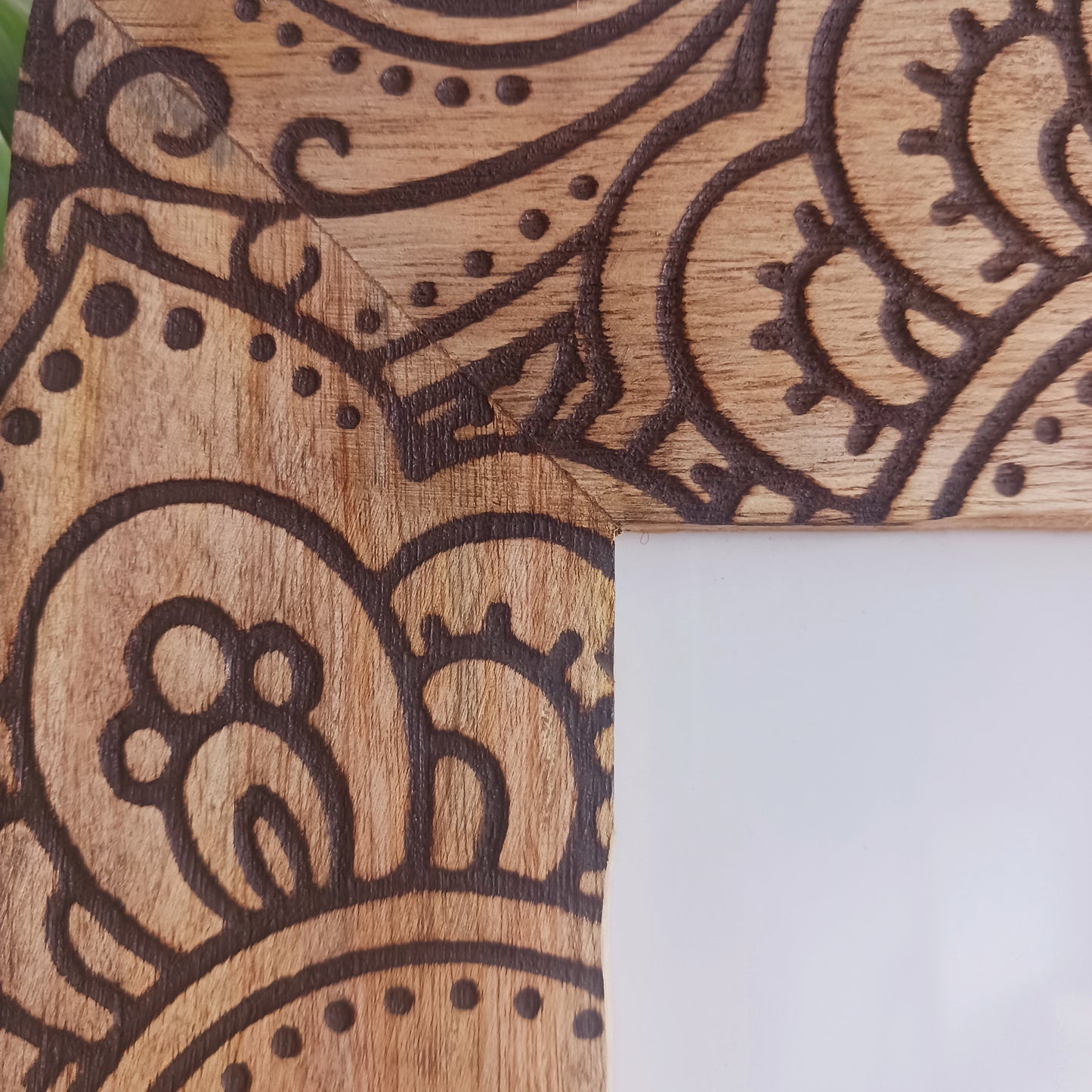 Made in India from sustainably sourced mango wood, these lovely picture frames bring warmth, character, and meaning to any space. Each one is carefully carved or painted with spiritual and cultural designs that go beyond decoration holding deep symbolism and tradition. The small Buddha in the corner is a peaceful presence that represents wisdom and enlightenment. Ideal for meditation spaces, yoga studios, or anyone seeking a sense of calm.