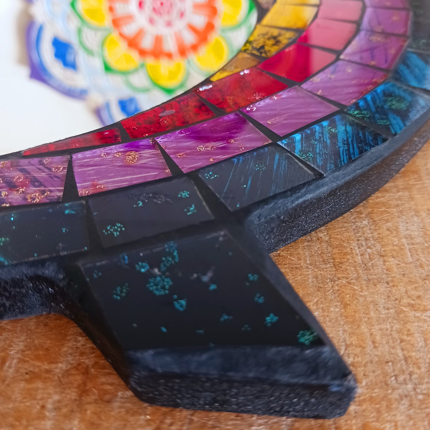 Bring colour, charm, and character to your home with this beautiful Sweet Mosaic Owl Mirror. Handcrafted under fair trade practices, this unique piece features a vibrant, multi-coloured mosaic owl surrounding a functional mirror. Perfect for brightening hallways, bedrooms, or living spaces, this decorative mirror blends artistry with practicality.