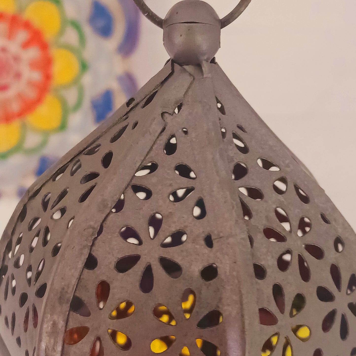 This delightful little seven-sided standing lantern has each side elegantly showcasing a chakra symbol. With a convenient bottom-opening door that doubles as a candle holder tray, this lantern is practical and attractive.